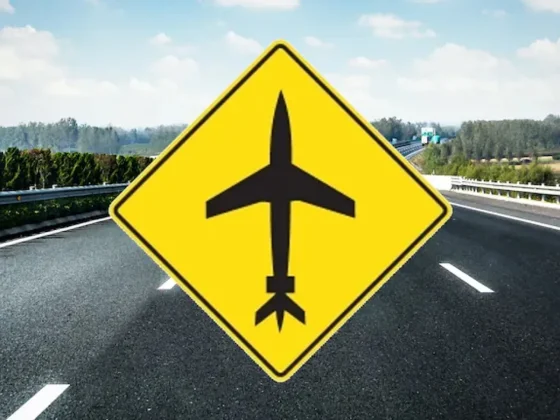 Qué significa la señal de tránsito que tiene un avión negro en el centro y el fondo amarillo